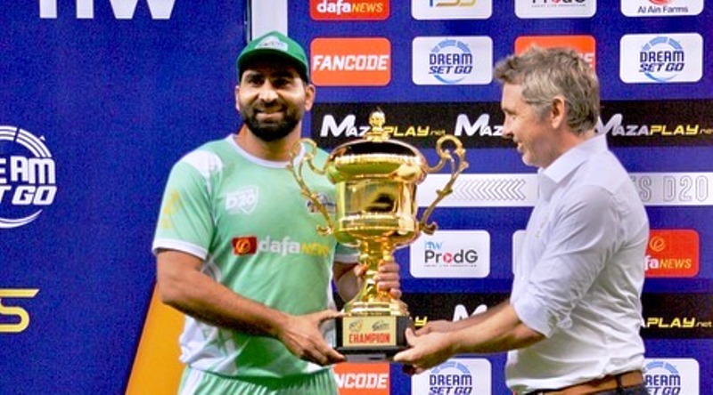 Muhammad Waseem (Captain of Fujairah) poses with the trophy after winning Emirates D20 2022.