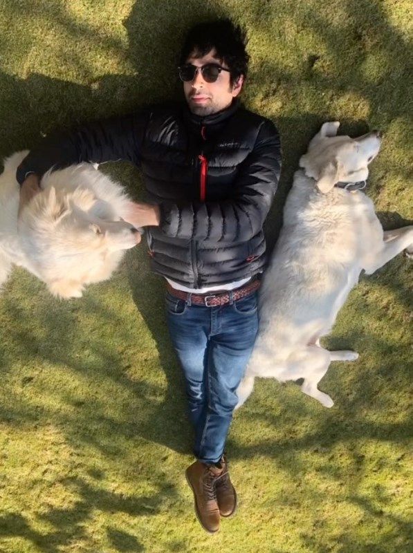 Varun Mitra playing with his dog