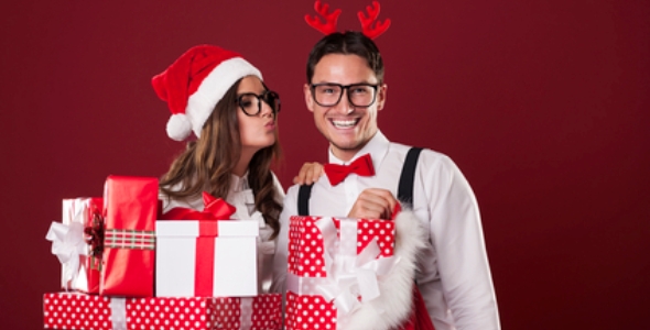 Loving couple with lots of Christmas gifts