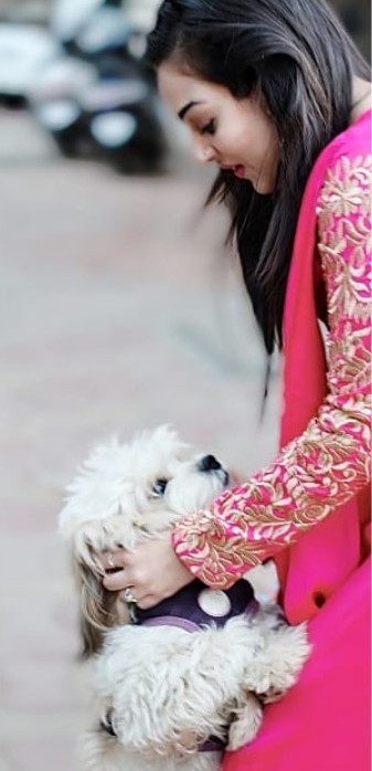 Nehalaxmi Iyer playing with her dog