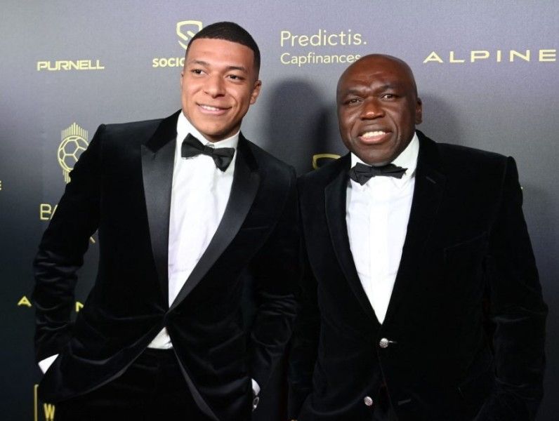 Kylian Mbappe with his father
