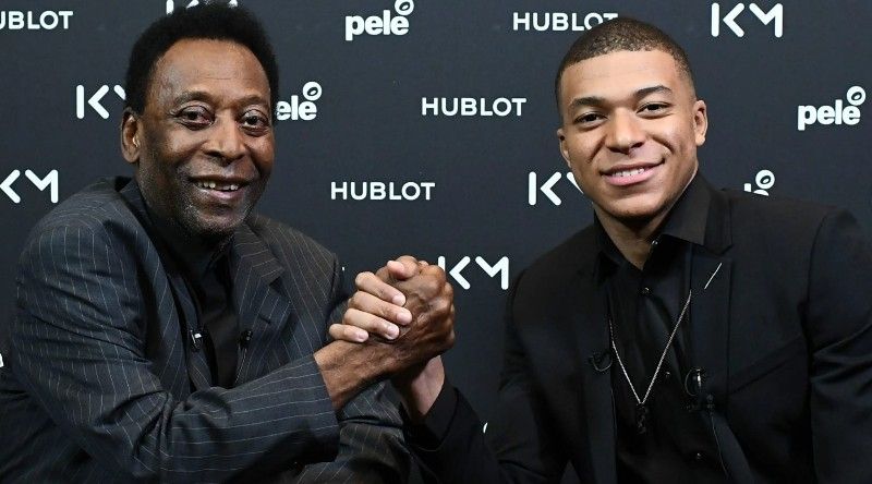 Kylian Mbappe (left) with Pele
