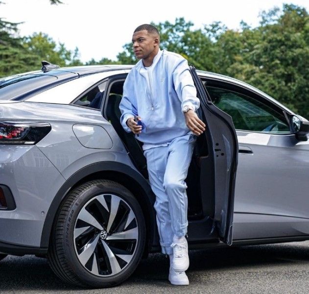 Kylian Mbappe riding a Volkswagen Touareg