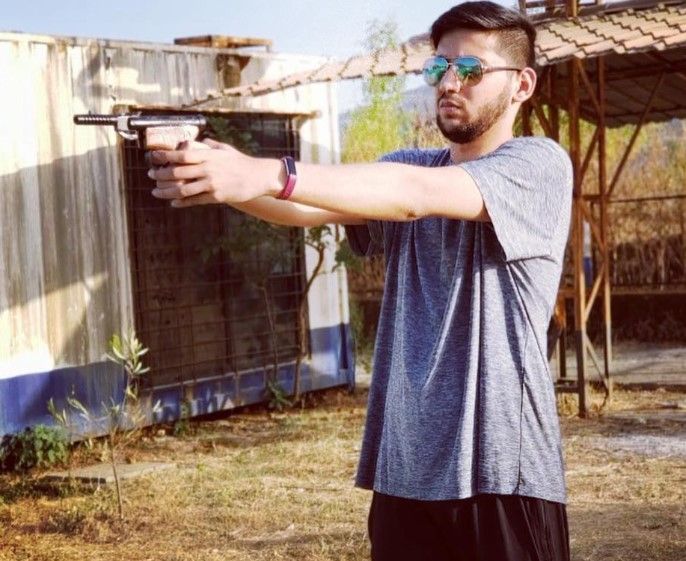 Rudracie Joshi practicing with a gun