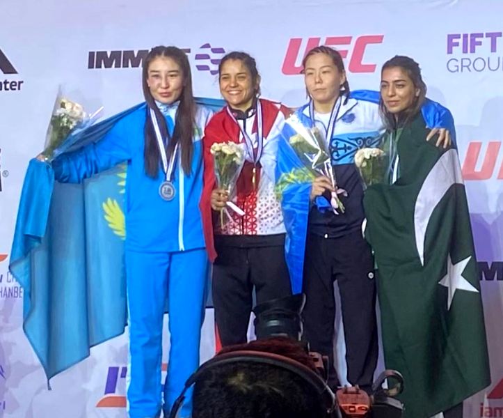 Eman Falcon Khan (far right) after winning the bronze medal at the 2022 IMMAF Asia Championships in Dushanbe, Tajikistan.