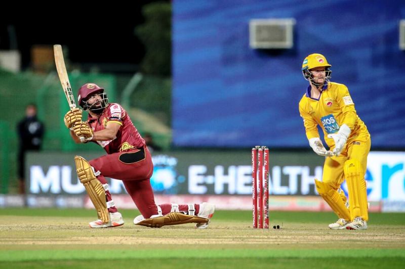 Northern Warriors' Wasim Muhammad (left) takes a shot against Team Abu Dhabi during an Abu Dhabi T10 League match