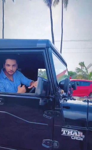 Shivam Khajuria sitting on his Thar