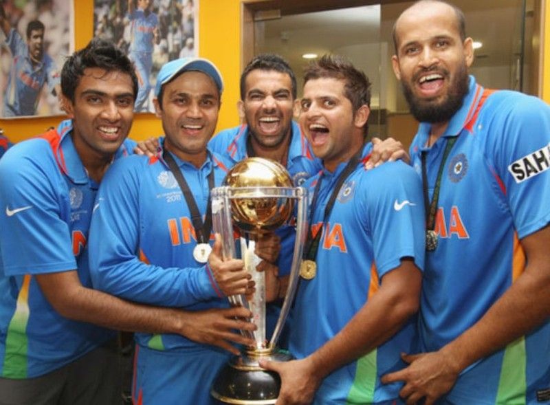 Ravichandran Ashwin, Virender Sehwag, Zaheer Khan, Suresh Raina and Yusuf Pathan (from left to right) holding the 2011 ODI World Cup trophy.
