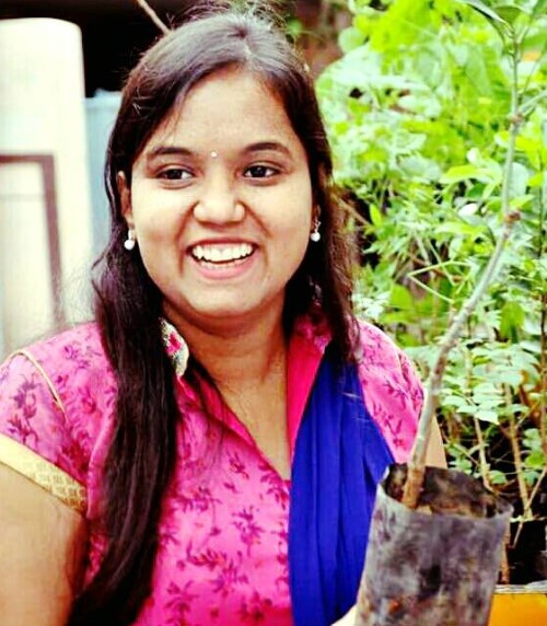G. Lasya Nanditha while planting saplings