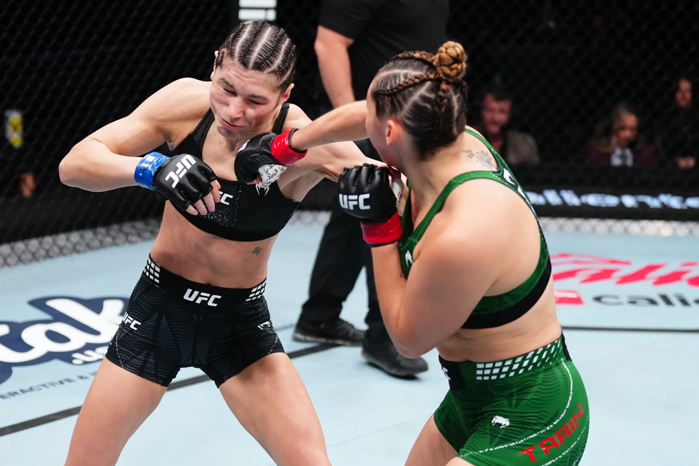 MEXICO CITY, MEXICO - FEBRUARY 28: (RL) Regina Tarin of Mexico punches Ernesta Carekaite of Lithuania during their catchweight bout at UFC Fight Night at Arena CDMX in Mexico City, Mexico on February 28, 2026. (Photo: Jeff Bottari/Zuffa LLC)