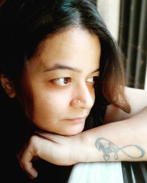 A photo of Hetal Dave with a tattoo on his left hand.