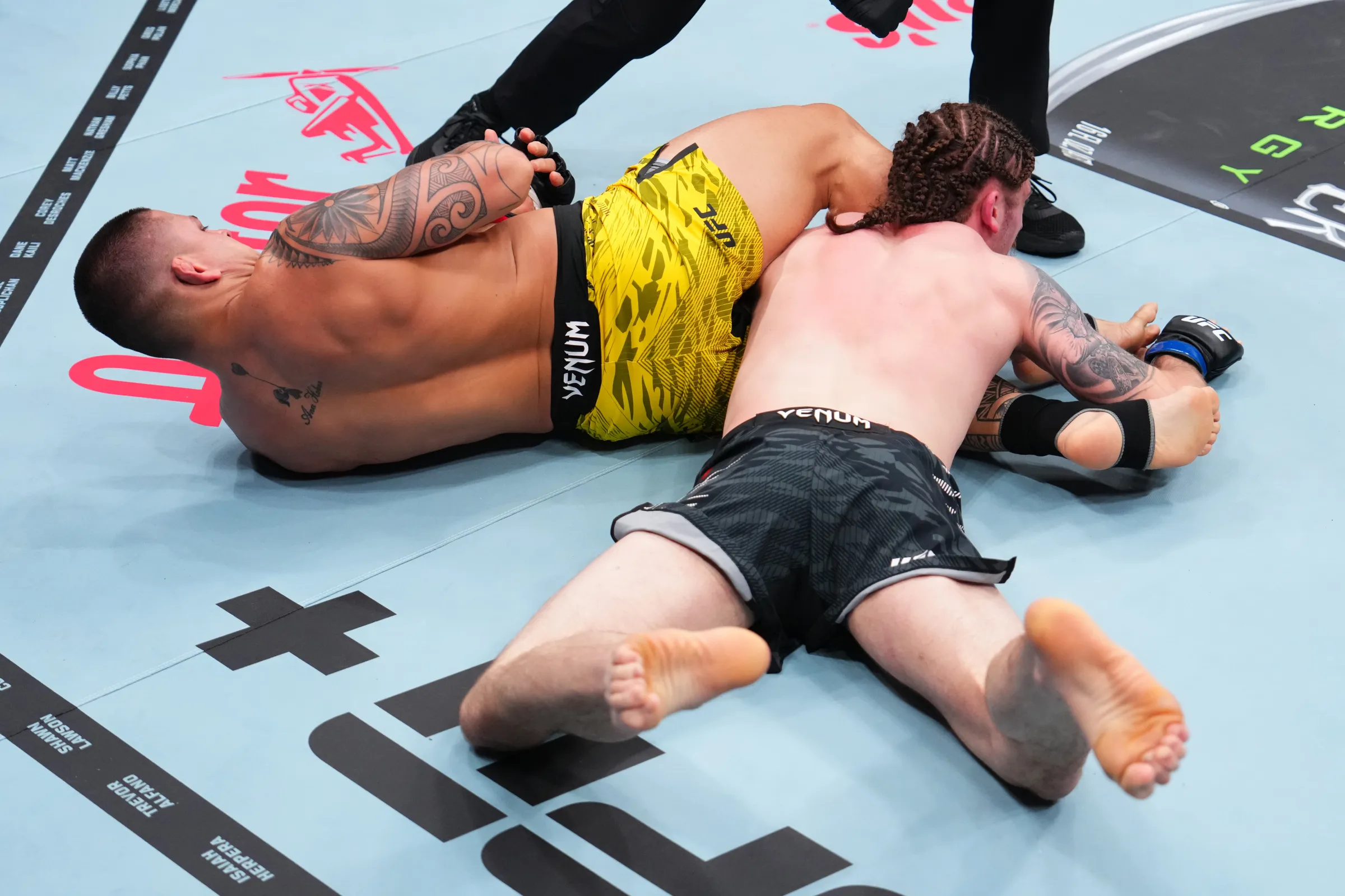 NEW ORLEANS, LA - JULY 19: (LR) Bruno Ferreira of Brazil secures an armbar submission against Jackson McVay in their middleweight bout at UFC 318 at the Smoothie King Center in New Orleans, Louisiana on July 19, 2025. (Photo courtesy of Cooper Neill/Zuffa LLC)