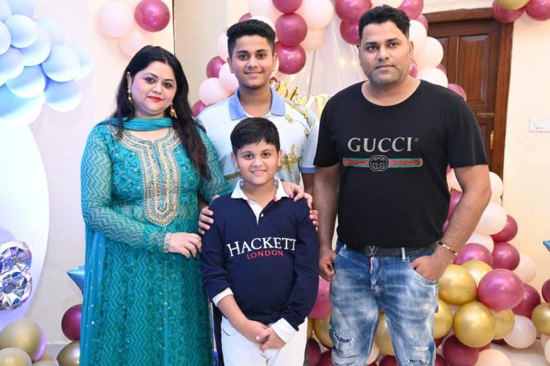 Aditya Raj with his wife and son