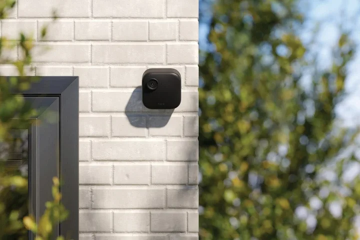 Blink Outdoor Camera 4 installed on a brick wall.