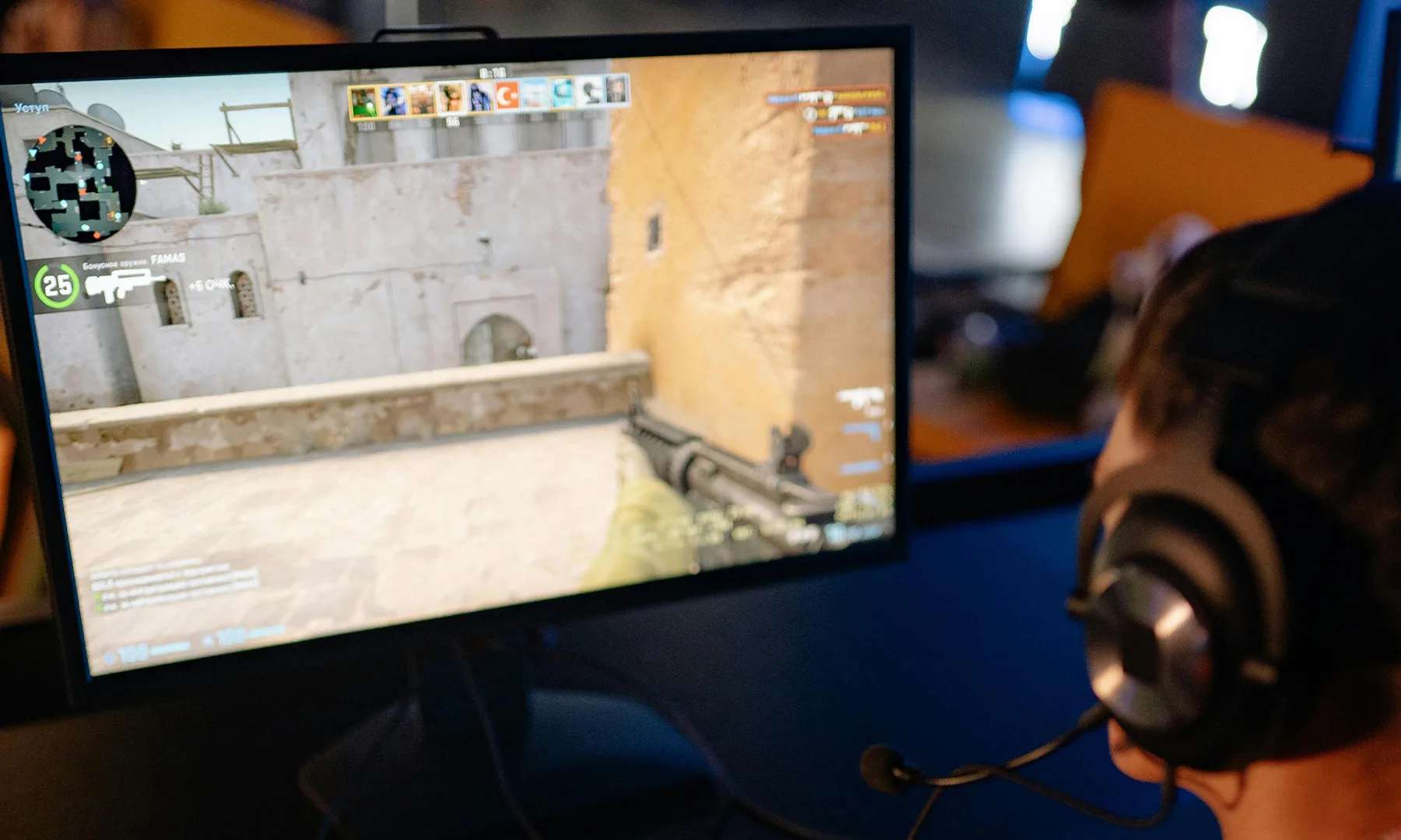 Man playing Counter Strike on PC monitor game