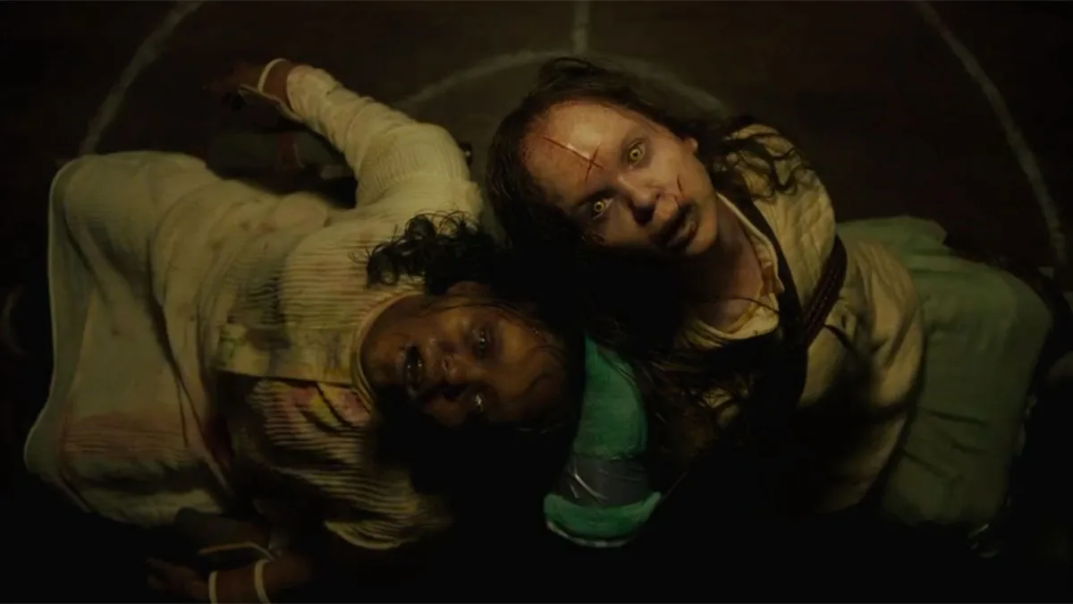 In The Exorcist: Believer, Angela Fielding (Lydia Jouett) and Catherine West (Olivia O'Neill) look up while possessed.