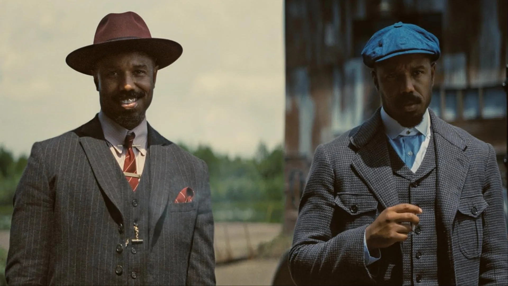 Twin brothers Smoke and Stack (Michael B. Jordan) stand next to each other and grin, the latter holding a cigarette in Ryan Coogler's horror film 'Sinners'.